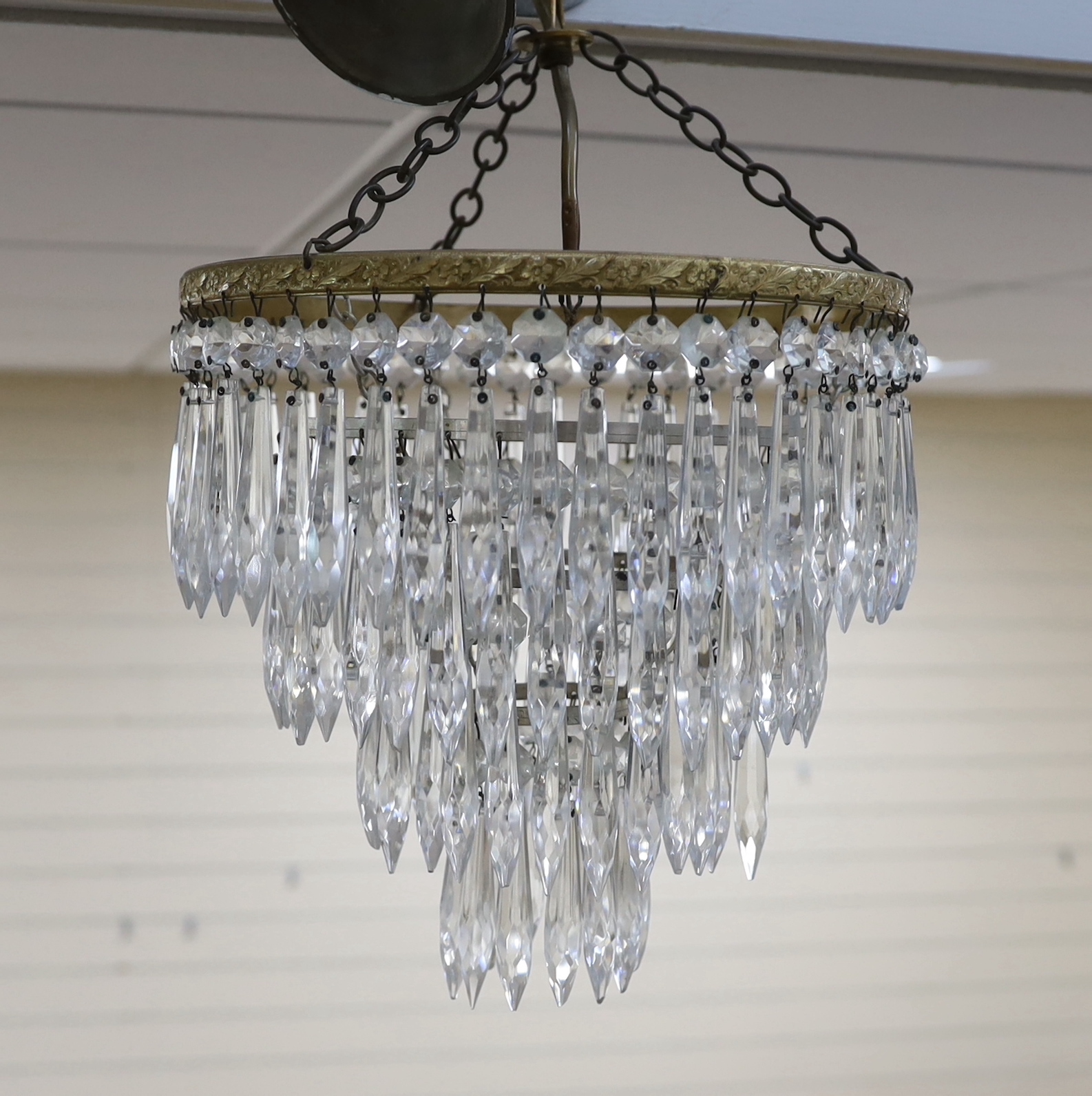 A pair of cut glass four tier chandeliers, 26.5cm wide